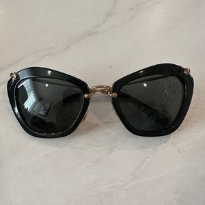 Miu Miu cat eye sunglasses.